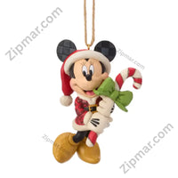Thumbnail for Enesco Jim Shore Minnie Mouse holiday ornament — red plaid folk art dress, Santa hat, holding candy cane with green ribbon bow