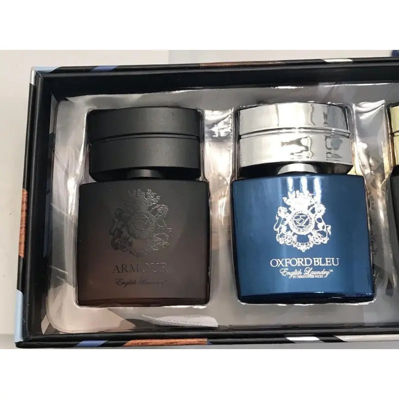 Close-up view of the English Laundry Armour and Oxford Bleu mini fragrance bottles in their packaging.