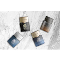 Thumbnail for Four English Laundry mini fragrance bottles arranged artistically on a white marble surface.