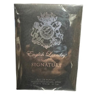 Thumbnail for Detailed shot of the English Laundry Signature bottle showing the brand crest and clear glass.