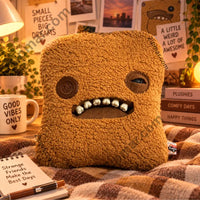 Thumbnail for Fuggler Bigg Nuggets plush styled on a plaid blanket with a notebook and mug