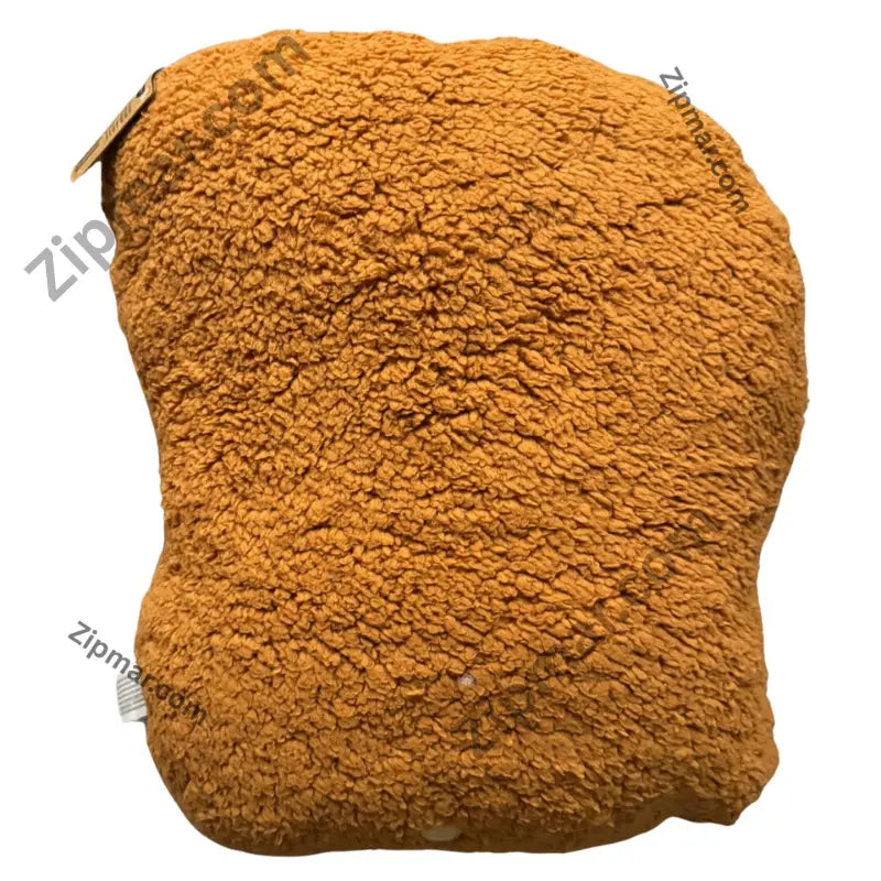 Back of Fuggler Bigg Nuggets plush in orange brown curly sherpa with sewn in tag