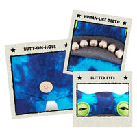 Thumbnail for Fuggler Funny Ugly Monster Laboratory Misfits Edition detail showing human-like teeth slitted eyes and butt-on-hole button