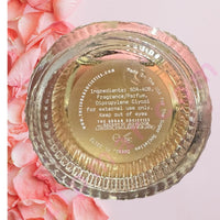 Thumbnail for Gold container lid with text on a pink floral background