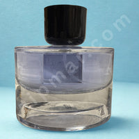 Thumbnail for Clear glass bottle with black cap on a blue background