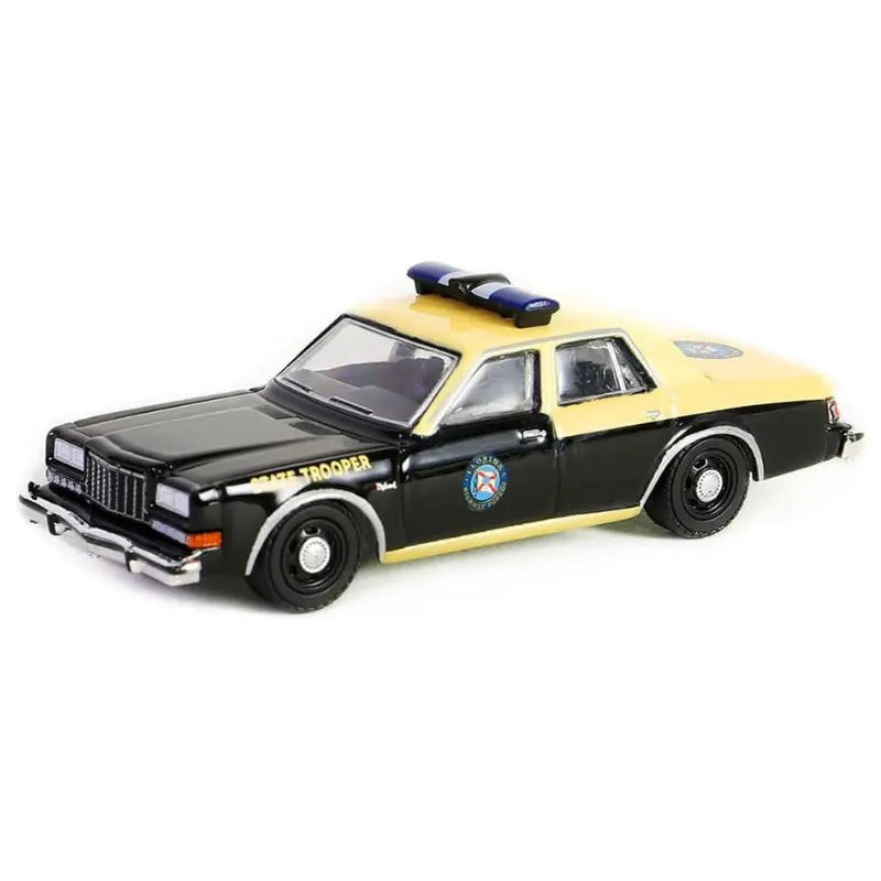 Three-quarter front view of GreenLight 1:64 Florida Highway Patrol 1983 Dodge Diplomat diecast car.