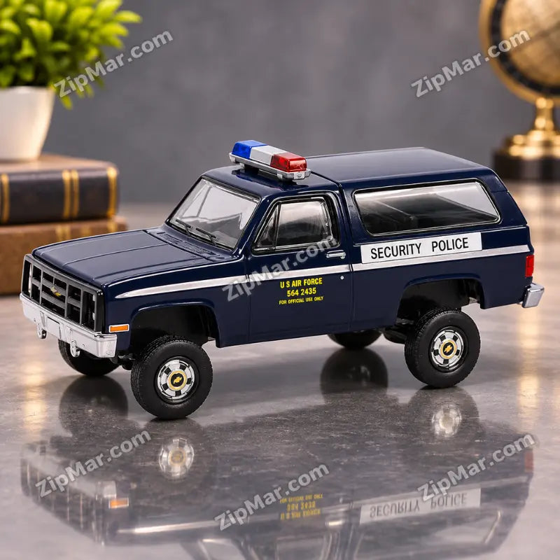 Side view of GreenLight 1:64 scale 1984 Chevrolet M1009 CUCV U.S. Air Force Security Police dark blue die-cast truck with light bar