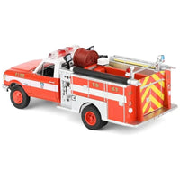 Thumbnail for Rear three-quarter view of the FDNY pumper truck diecast showing yellow and red safety chevrons.