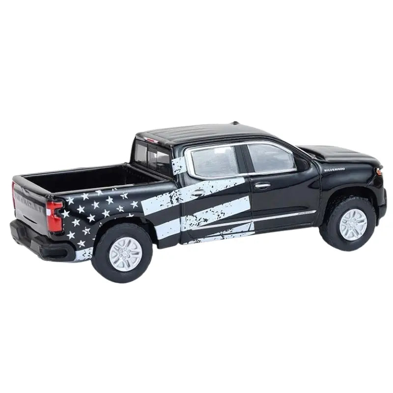 Rear three quarter view of Greenlight Silverado with flag graphic bed wrap