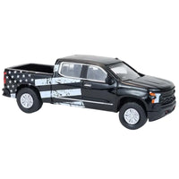 Thumbnail for Side angle view of Greenlight Silverado with American flag graphic wrap