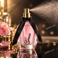 Thumbnail for Guess Girl eau de toilette bottle with black ribbon spraying mist