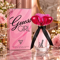 Thumbnail for Guess Girl eau de toilette 3.4 fl oz pink box beside bottle with pink cap and black ribbon
