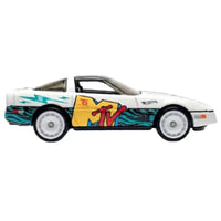Thumbnail for Side profile of Hot Wheels MTV 84 Corvette diecast car with teal and yellow livery