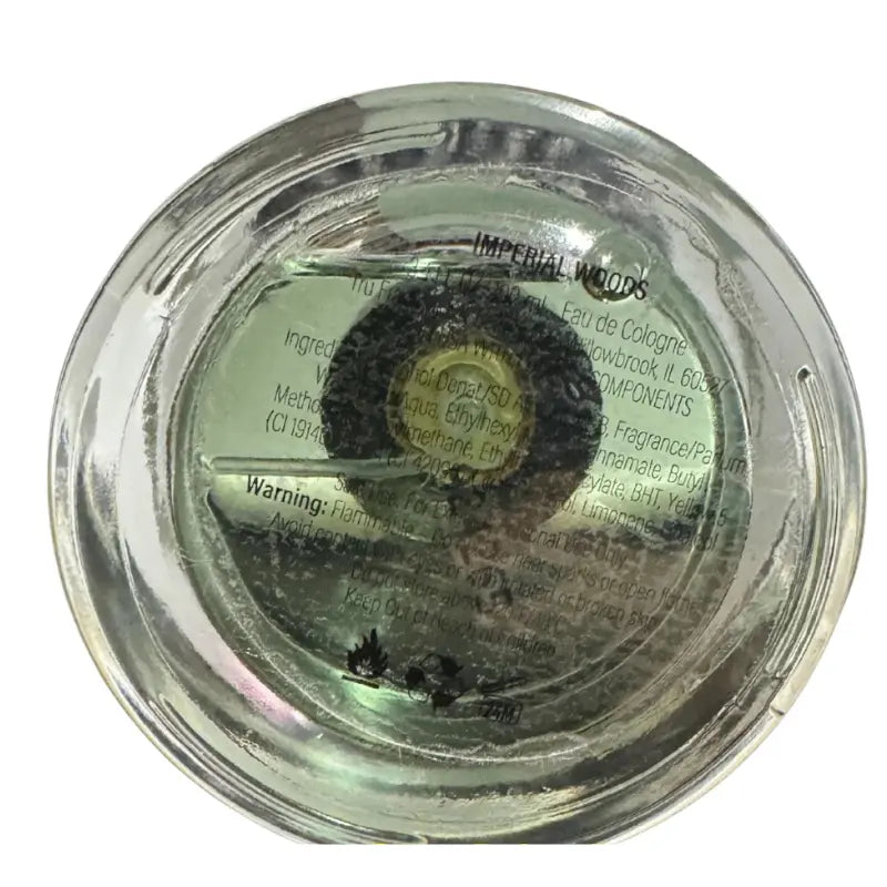 Bottom view of the Tru Fragrance Imperial Woods bottle showing the manufacturer details and 3.4 oz size.