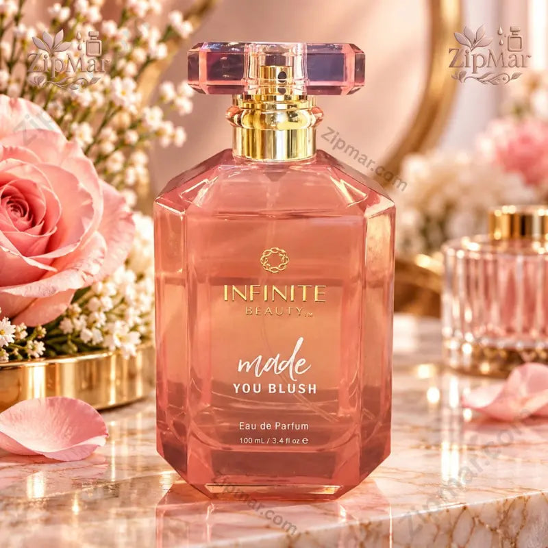 Infinite Beauty Made You Blush Eau de Parfum 3.4 fl oz rose-pink faceted bottle front view with floral display