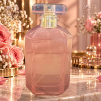 Thumbnail for Infinite Beauty Made You Blush 100 mL Eau de Parfum faceted pink glass bottle angled side view with roses