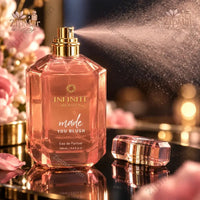 Thumbnail for Infinite Beauty Made You Blush Eau de Parfum 3.4 oz rose-pink faceted bottle spraying with cap removed