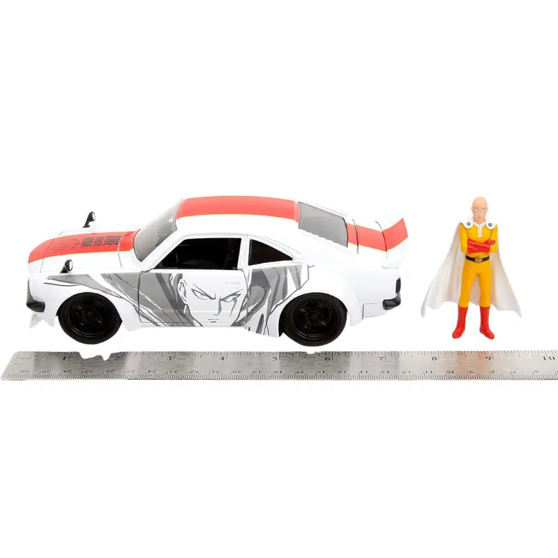 Saitama figure and 1974 Mazda RX-3 diecast car shown next to ruler for scale comparison