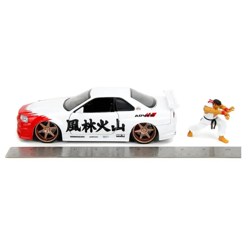 Jada 1:24 scale Nissan Skyline R34 with Ryu diecast figure and ruler measurement