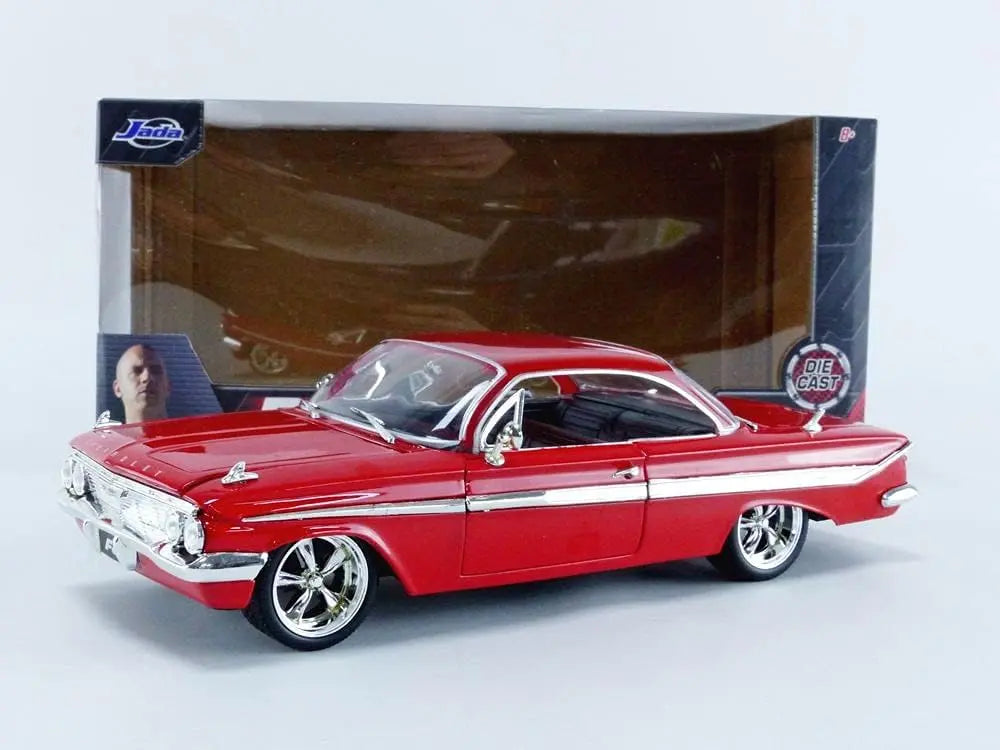 The Jada Toys Fast & Furious F8 1961 Chevy Impala 1:24 die-cast model safely secured within its original window box packaging.