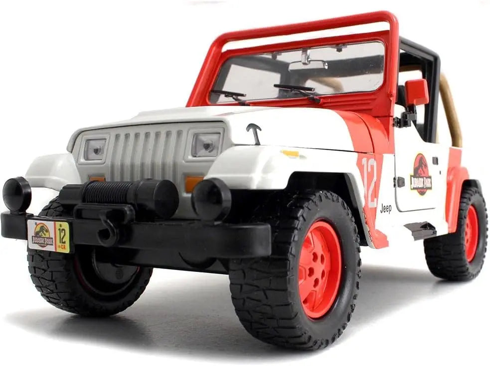 Low-angle front three-quarter perspective of the Jada Toys Jeep Wrangler JP12 emphasizing the aggressive tires and front winch.