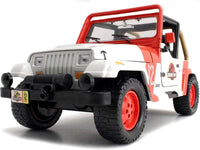 Thumbnail for Low-angle front three-quarter perspective of the Jada Toys Jeep Wrangler JP12 emphasizing the aggressive tires and front winch.