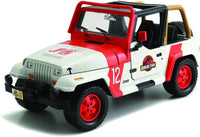 Thumbnail for Jada Toys 1:24 scale Jurassic World diecast Jeep Wrangler JP12 in original window box packaging showing front winch and T-Rex graphics.