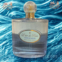 Thumbnail for Front view of L'air de Paris Cote d'Azur perfume bottle displayed over vibrant blue rippled water backdrop