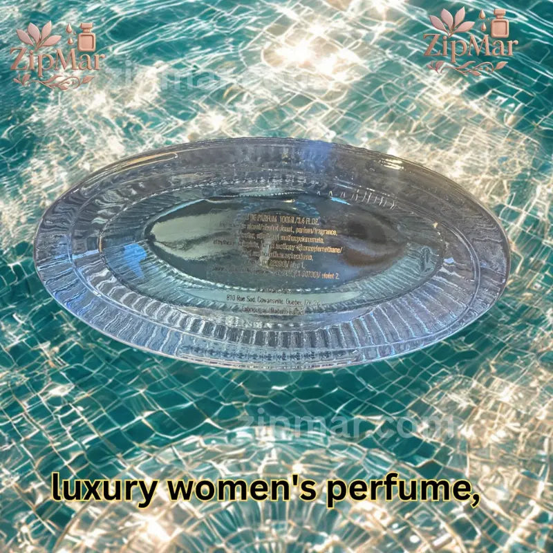 Underside view of glass bottle showing Eau de Parfum concentration, 100ml size, and manufacturer info over pool water pattern