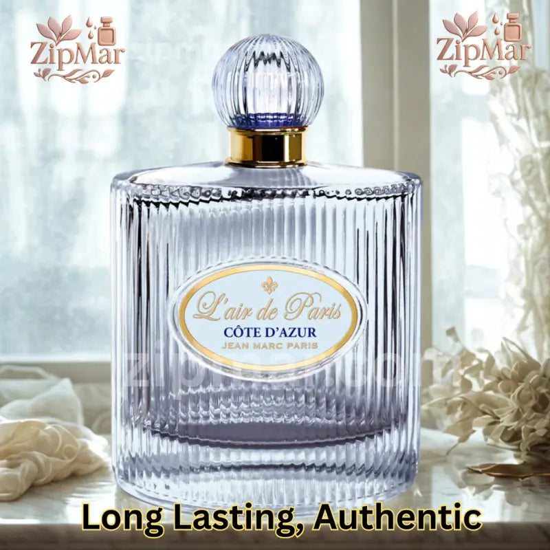 Front display of L'air de Paris Cote d'Azur EDP bottle on elegant marble surface with white curtain lighting