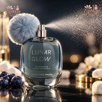 Thumbnail for Jean Marc Paris Lunar Glow Eau de Parfum 3.4 oz spraying with fluffy blue pom-pom and blueberry marshmallow styling