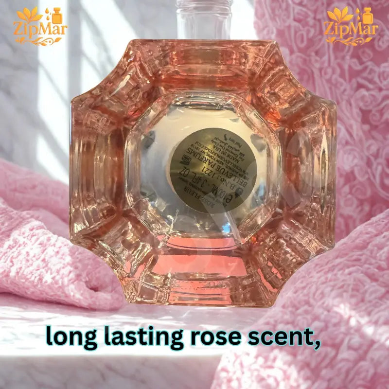 Rose Fleur fragrance bottle base with sticker showing 100 mL, 3.4 fl oz, batch number, Bellevue Parfums and Made in USA