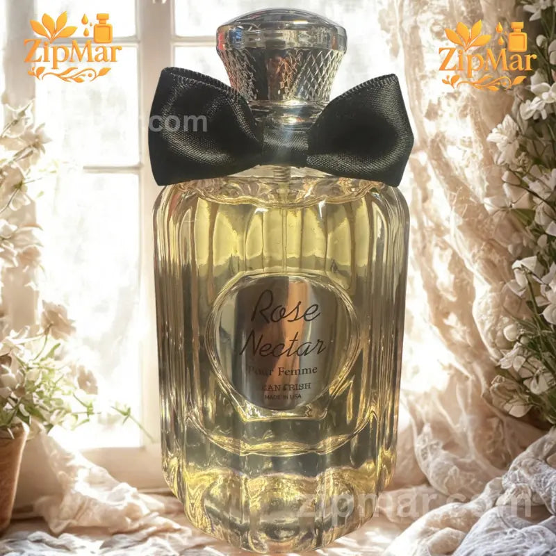 Side angle view of Jean Rish Rose Nectar Pour Femme spray bottle by window