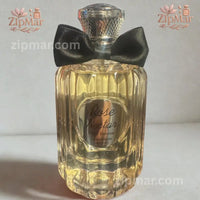Thumbnail for Front view of Jean Rish Rose Nectar Pour Femme Eau de Parfum bottle with silver medallion and black bow tie