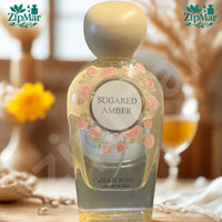 Thumbnail for Jean Rish Sugared Amber Eau de Parfum 100 mL 3.4 fl oz clear glass bottle with cream cap and rose print label