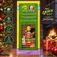 Thumbnail for Jim Shore Grinch in Ugly Sweater Statue box back panel with designer photo, signature and description in three languages