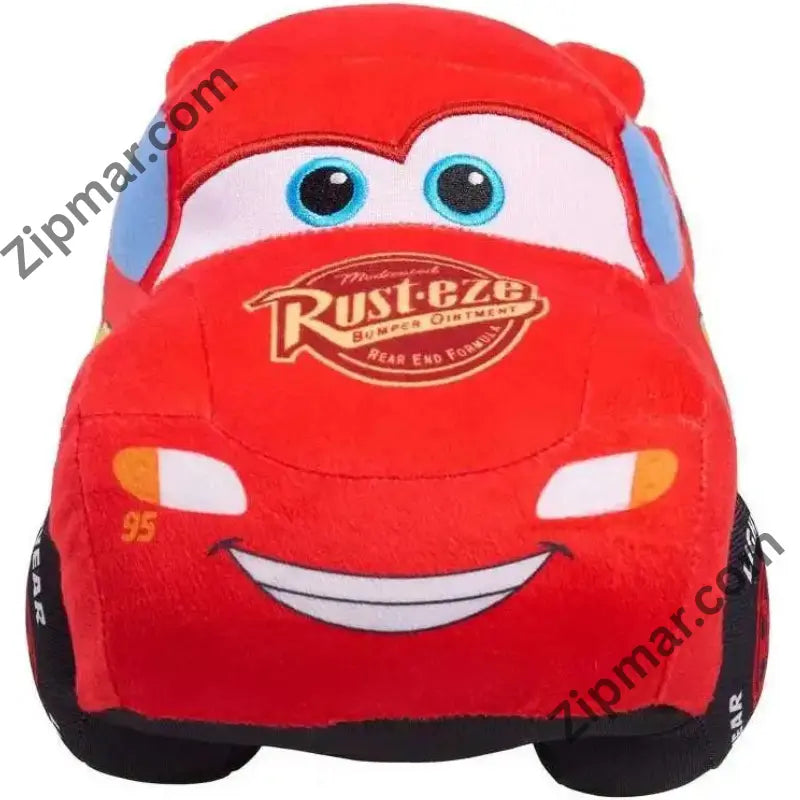 Front view of Lightning McQueen plush with blue eyes, Rust-eze logo and wide smile