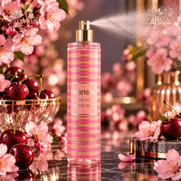 Thumbnail for kensie Floral Crush Body Mist 8 fl oz pink and gold spray bottle with cherry blossoms and cherries on dark marble