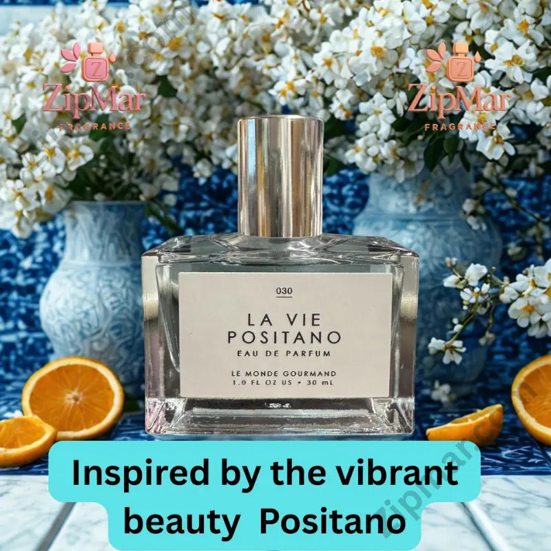 La Vie Positano EDP label showing Le Monde Gourmand No. 030, Eau de Parfum, 1.0 FL OZ / 30 mL warm amber background with floral and lemon elements