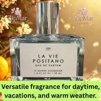 Thumbnail for La Vie Positano Eau de Parfum styled on blue Mediterranean tile with orange slices and white blooms inspired by Positano, Amalfi Coast