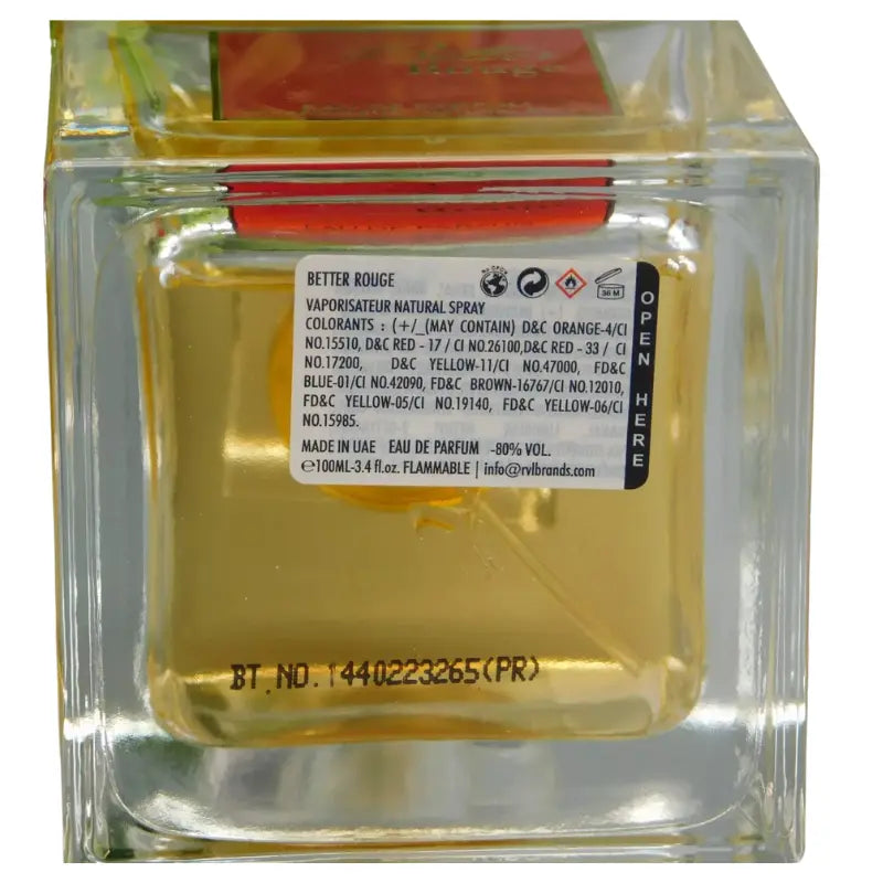 The bottom of the Lattafa Better Rouge perfume bottle, showing the clear square base and detailed label with batch code, ingredients, and manufacturer information.