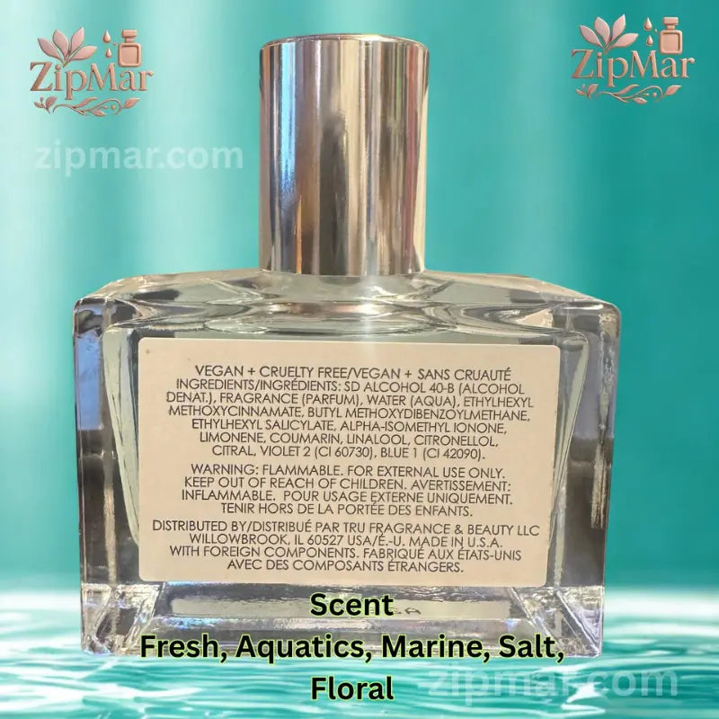 Front display of 009 Sel Ocean perfume bottle resting on natural stone with seashell background