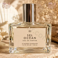 Thumbnail for Front view of Le Monde Gourmand Sel Ocean EDP bottle against stylized turquoise water waves
