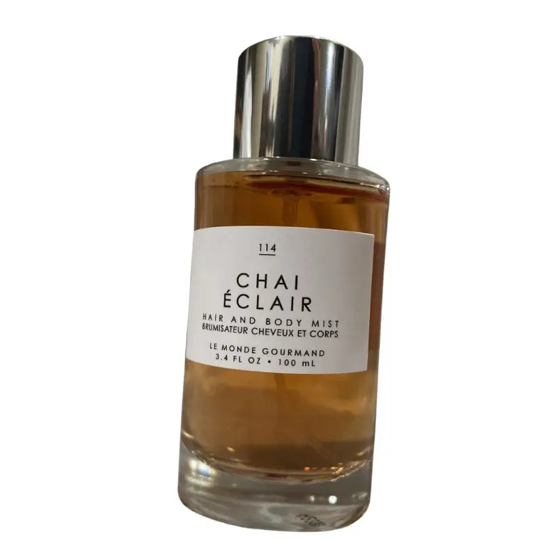 Front view of Le Monde Gourmand Chai Éclair 3.4 oz bottle, with text comparison emphasizing the Hair & Body Mist type.