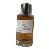 Thumbnail for Front view of Le Monde Gourmand Chai Éclair 3.4 oz bottle, with text comparison emphasizing the Hair & Body Mist type.