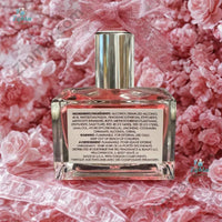 Thumbnail for Le Monde Gourmand Le Bubble Pop Eau de Parfum 30ml bottle with vibrant pink liquid silver chrome cap and white label on marble surface — gourmand lifestyle editorial with fresh strawberries pink macarons pink peony blooms white florals and crystal glass props in warm natural window light
