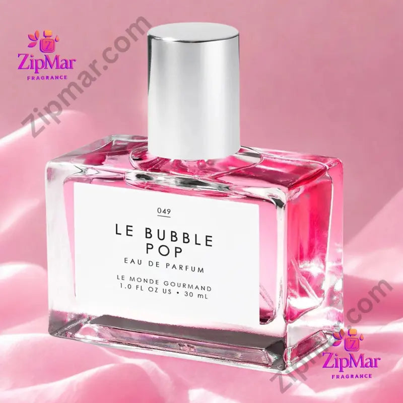 Le Monde Gourmand Le Bubble Pop Eau de Parfum 30ml wide faceted clear glass bottle with bright pink liquid silver cap and white label on colorful pink blue background surrounded by pastel bubble props playful gifting lifestyle image