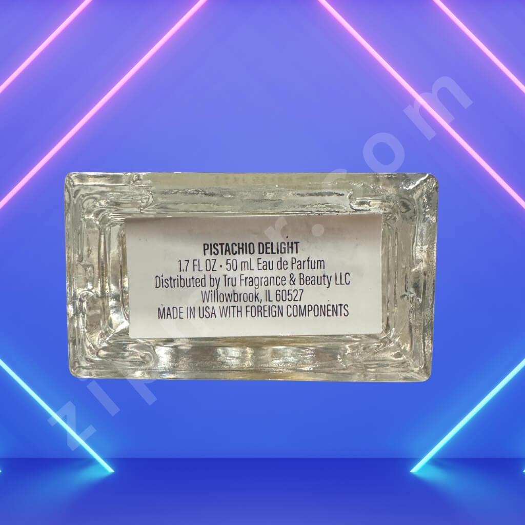 Perfume bottle labeled 'Pistachio Delight' on a blue and pink geometric background