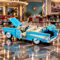 Thumbnail for Maisto 1957 Chevrolet Bel Air convertible model with door and trunk open showing cream interior