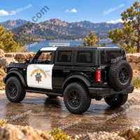 Thumbnail for Rear view of Maisto Ford Bronco Highway Patrol model with spare tire and Highway Patrol door badge